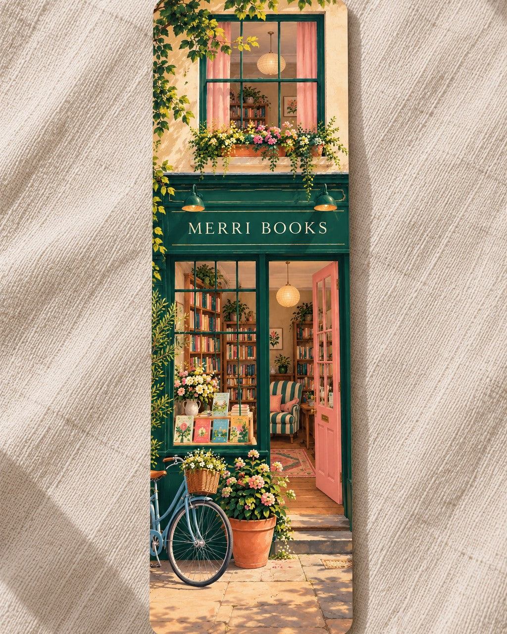 A MERRI illustrated bookmark showing the MERRI Books shopfront with a bicycle and flowers