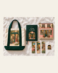 The Ultimate Book Lover's Collection laid out: the book tote, A Year in Books journal, the book pouch, three bookmarks and the enamel pin