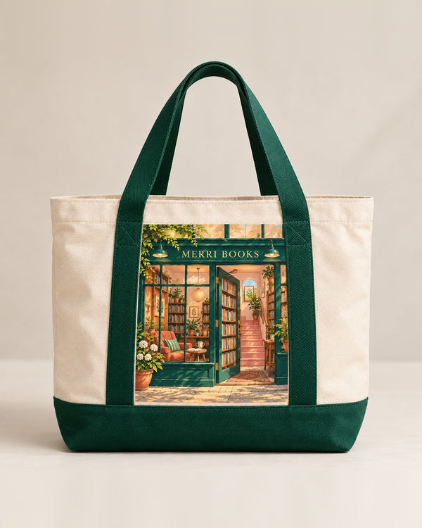 The MERRI Book Tote in cream canvas with forest green handles and the MERRI Books shopfront print